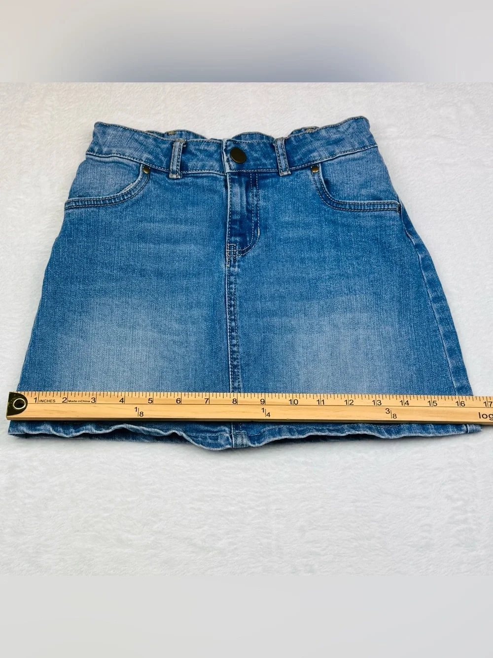 Lot of 2 girls denim skirts. The blue shirt is a size 8, black skirt is size 7/8